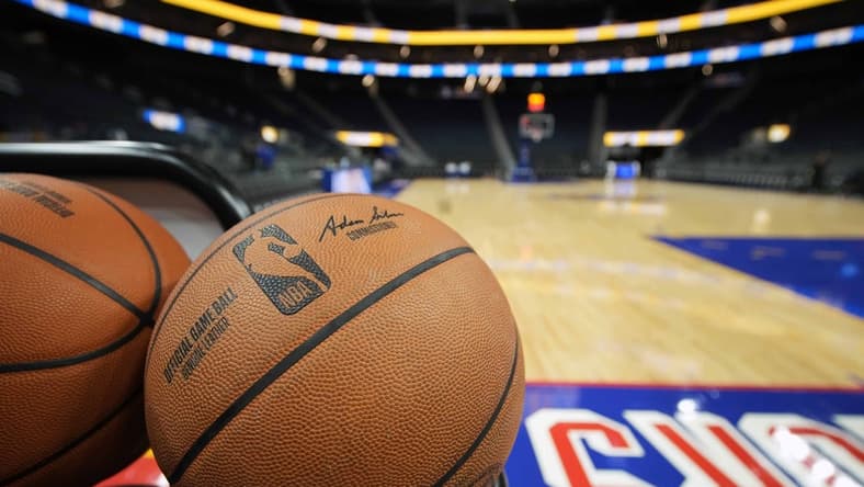 Mar 12, 2022; San Francisco, California, USA; A rack of basketballs sit on the baseline before the game between the Golden State Warriors and the Milwaukee Bucks at Chase Center. Mandatory Credit: Darren Yamashita-USA TODAY Sports