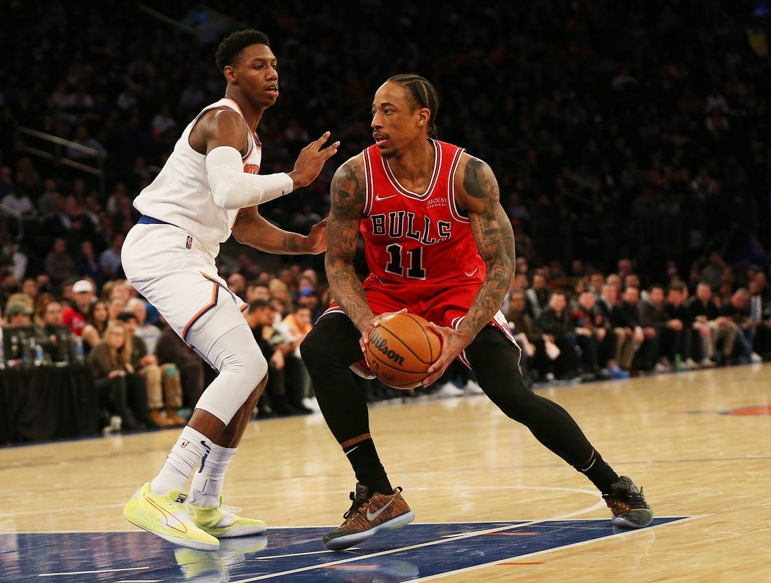 Mar 28, 2022; New York, New York, USA: Chicago Bulls forward DeMar DeRozan (11) drives to the basket against New York Knicks guard RJ Barrett (9) during the second half at Madison Square Garden. Mandatory Credit: Andy Marlin-USA TODAY Sports