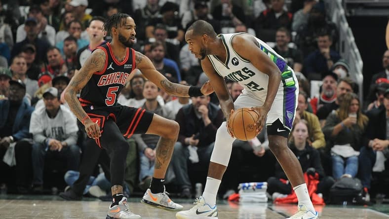 Apr 20, 2022; Milwaukee, Wisconsin, USA; Chicago Bulls forward Derrick Jones Jr. (5) defends Milwaukee Bucks forward Khris Middleton (22) in the first half during game two of the first round for the 2022 NBA playoffs at Fiserv Forum. Mandatory Credit: Michael McLoone-USA TODAY Sports