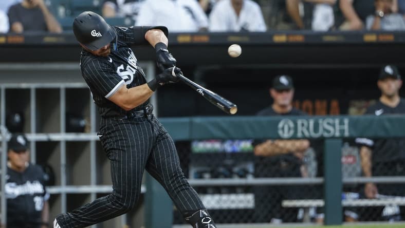 Jun 21, 2022; Chicago, Illinois, USA; Chicago White Sox second baseman Danny Mendick (20) singles against the Toronto Blue Jays during the third inning at Guaranteed Rate Field. Mandatory Credit: Kamil Krzaczynski-USA TODAY Sports