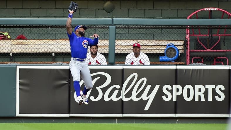 Jun 24, 2022; St. Louis, Missouri, USA; Chicago Cubs right fielder Jason Heyward (22) leaps and catches a fly ball against the St. Louis Cardinals during the second inning at Busch Stadium. Mandatory Credit: Jeff Curry-USA TODAY Sports
