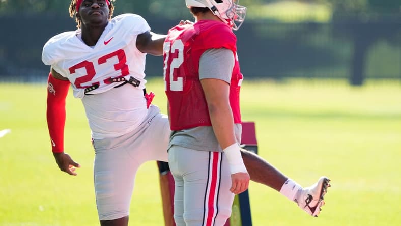 Aug 11, 2022; Columbus, OH, USA; Ohio State Buckeyes defensive end Omari Abor (23) stretches with offensive lineman Avery Henry (72) during football camp at the Woody Hayes Athletic Center. Mandatory Credit: Adam Cairns-The Columbus Dispatch
Ohio State Football Camp
