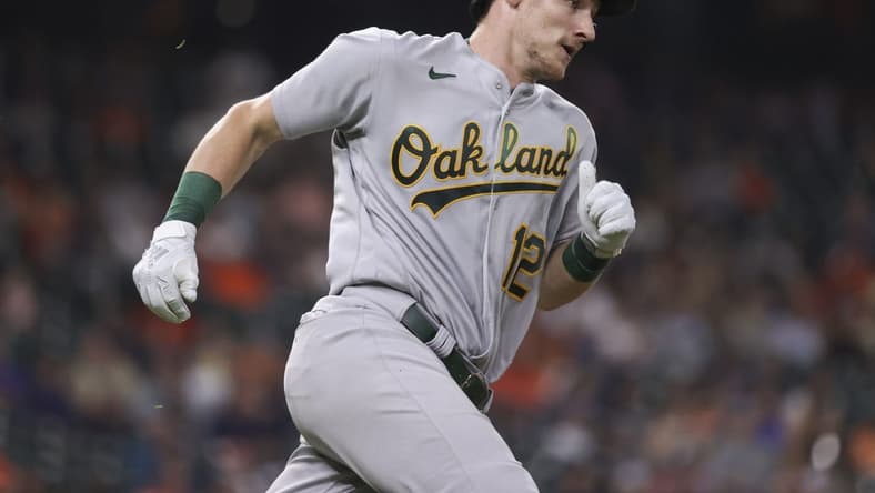 Sep 15, 2022; Houston, Texas, USA; Oakland Athletics catcher Sean Murphy (12) runs to first base on a double during the fourth inning against the Houston Astros at Minute Maid Park. Mandatory Credit: Troy Taormina-USA TODAY Sports