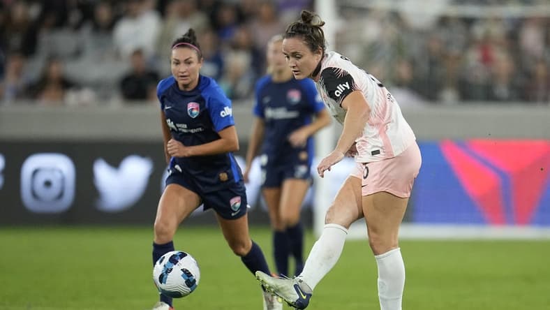 Sep 17, 2022; San Diego, California, USA; Angel City FC defender Megan Reid (6) attempts a pass against San Diego Wave FC in the second half at Snapdragon Stadium. Mandatory Credit: Ray Acevedo-USA TODAY Sports