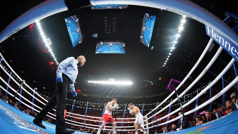 Sep 17, 2022; Las Vegas, Nevada, USA; Canelo Alvarez (red trunks) and Gennadiy Golovkin (white trunks) box during a middleweight championship bout at T-Mobile Arena. Mandatory Credit: Joe Camporeale-USA TODAY Sports