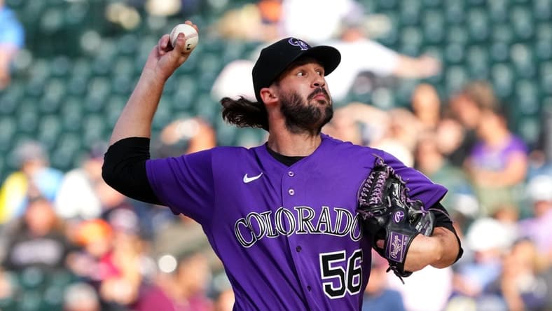 Sep 22, 2022; Denver, Colorado, USA; Colorado Rockies relief pitcher Chad Smith (56) pitches in the ninth inning against the San Francisco Giants at Coors Field. Mandatory Credit: Ron Chenoy-USA TODAY Sports