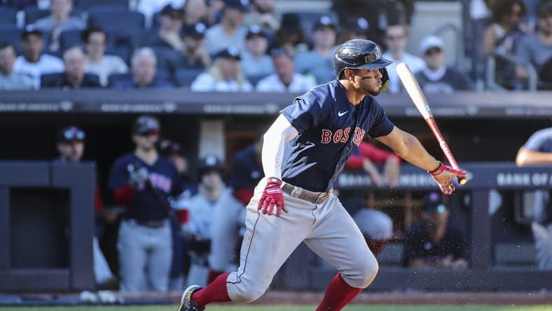 Sep 24, 2022; Bronx, New York, USA;  Boston Red Sox shortstop Xander Bogaerts (2) hits a single in the seventh inning against the New York Yankees at Yankee Stadium. Mandatory Credit: Wendell Cruz-USA TODAY Sports