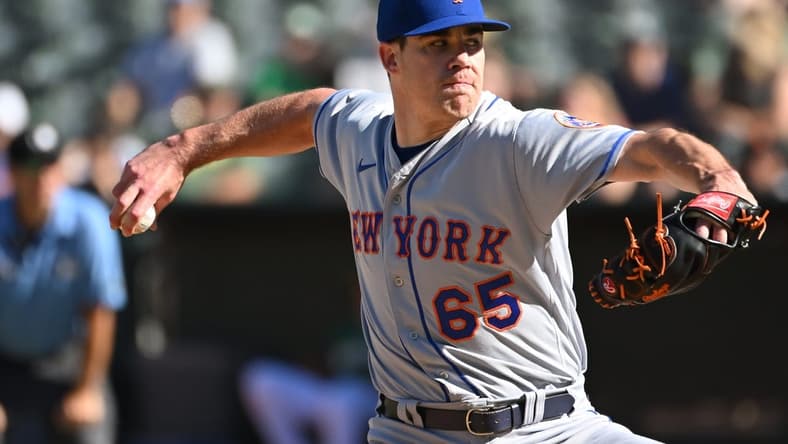 Sep 24, 2022; Oakland, California, USA; New York Mets relief pitcher Trevor May (65) throws a pitch against the Oakland Athletics during the eighth inning at RingCentral Coliseum. Mandatory Credit: Robert Edwards-USA TODAY Sports