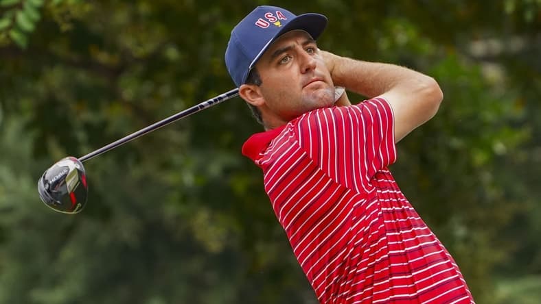 Sep 25, 2022; Charlotte, North Carolina, USA; Team USA golfer Scottie Scheffler hits his tee shot on the 17th hole during the singles match play of the Presidents Cup golf tournament at Quail Hollow Club. Mandatory Credit: Peter Casey-USA TODAY Sports
