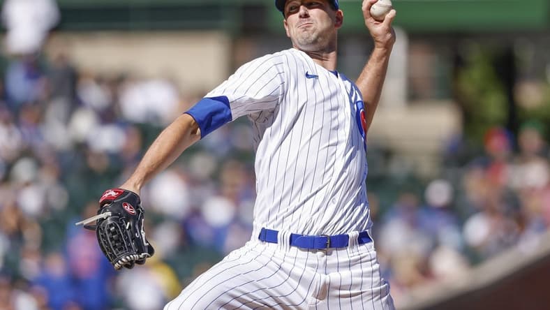 Oct 1, 2022; Chicago, Illinois, USA; Chicago Cubs starting pitcher Drew Smyly (11) delivers against the Cincinnati Reds during the first inning at Wrigley Field. Mandatory Credit: Kamil Krzaczynski-USA TODAY Sports