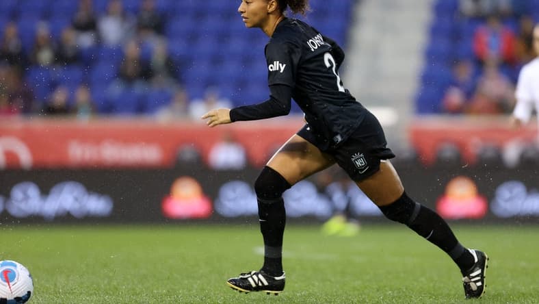 Oct 1, 2022; Harrison, New Jersey, USA; NJ/NY Gotham FC defender Estelle Johnson Mewis (24) kicks the ball against the Portland Thorns FC during the first half at Red Bull Arena. Mandatory Credit: Craig Mitchelldyer-USA TODAY Sports