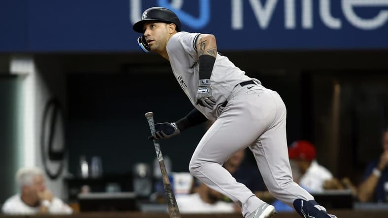 Oct 4, 2022; Arlington, Texas, USA; New York Yankees right fielder Marwin Gonzalez (14) singles in a run in the fifth inning against the Texas Rangers at Globe Life Field. Mandatory Credit: Tim Heitman-USA TODAY Sports