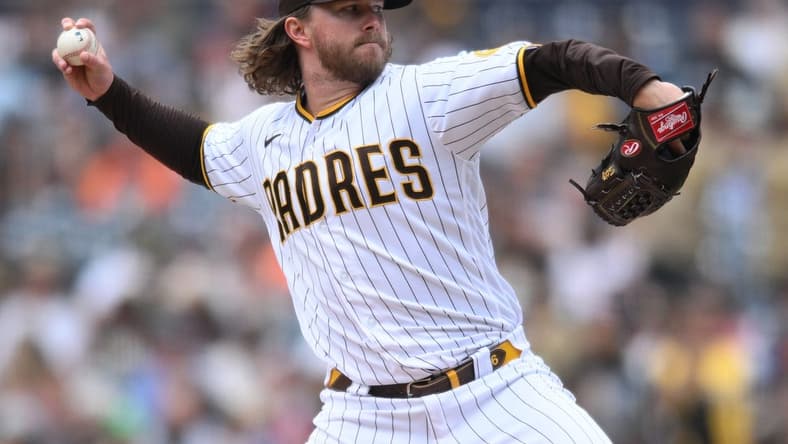 Oct 5, 2022; San Diego, California, USA; San Diego Padres relief pitcher Pierce Johnson (36) throws a pitch against the San Francisco Giants during the eighth inning at Petco Park. Mandatory Credit: Orlando Ramirez-USA TODAY Sports