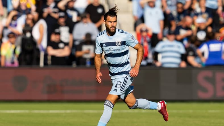 Oct 2, 2022; Kansas City, Kansas, USA; Sporting Kansas City midfielder Graham Zusi (8) controls the ball during the first half against the Seattle Sounders at Children's Mercy Park. Mandatory Credit: Jay Biggerstaff-USA TODAY Sports