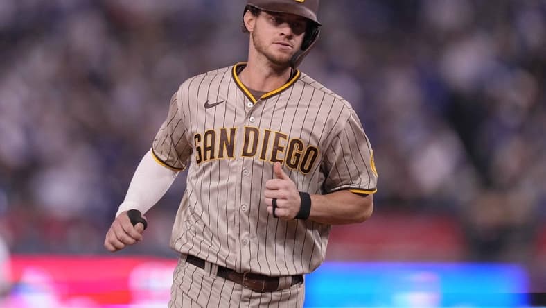 Oct 11, 2022; Los Angeles, California, USA; San Diego Padres right fielder Wil Myers (5) rounds the bases after hitting a home run during the fifth inning of game one of the NLDS for the 2022 MLB Playoffs against the Los Angeles Dodgers at Dodger Stadium. Mandatory Credit: Kirby Lee-USA TODAY Sports