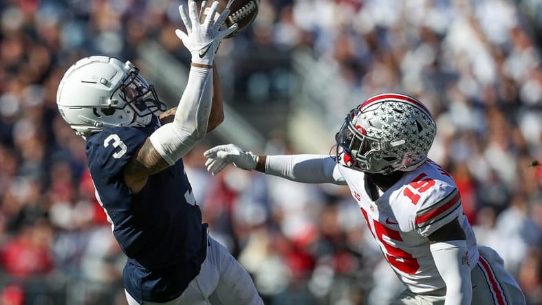 Oct 29, 2022; University Park, Pennsylvania, USA; Penn State Nittany Lions wide receiver Parker Washington (3) makes a catch as Ohio State Buckeyes safety Tanner McCalister (15) defends during the fourth quarter at Beaver Stadium. Ohio State defeated Penn State 44-31. Mandatory Credit: Matthew OHaren-USA TODAY Sports