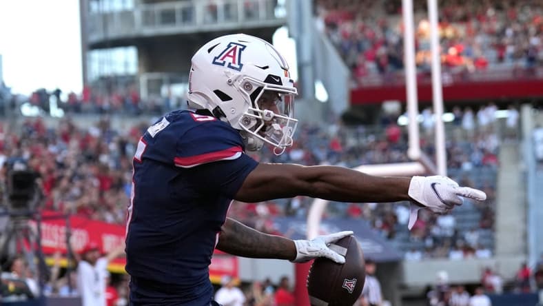 Oct 29, 2022; Tucson, Arizona, USA; Arizona Wildcats wide receiver Dorian Singer (5) reacts after being ruled out of bounds against the USC Trojans during the first half at Arizona Stadium. Mandatory Credit: Joe Camporeale-USA TODAY Sports