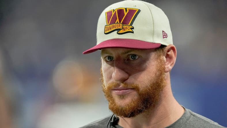Washington Commanders quarterback Carson Wentz (11) walks along the sideline Sunday, Oct. 30, 2022, during a game against the Indianapolis Colts at Indianapolis Colts at Lucas Oil Stadium in Indianapolis.
