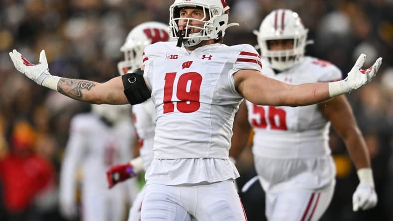 Nov 12, 2022; Iowa City, Iowa, USA; Wisconsin Badgers linebacker Nick Herbig (19) reacts after a sack against the Iowa Hawkeyes during the second quarter at Kinnick Stadium. Mandatory Credit: Jeffrey Becker-USA TODAY Sports