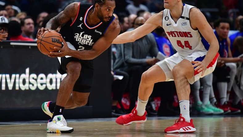 Nov 17, 2022; Los Angeles, California, USA; Los Angeles Clippers forward Kawhi Leonard (2) controls the ball against Detroit Pistons forward Bojan Bogdanovic (44) during the second half at Crypto.com Arena. Mandatory Credit: Gary A. Vasquez-USA TODAY Sports
