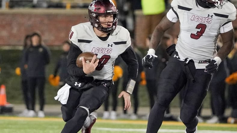 Nov 19, 2022; Columbia, Missouri, USA; New Mexico State Aggies quarterback Diego Pavia (10) runs the ball against the Missouri Tigers during the first half at Faurot Field at Memorial Stadium. Mandatory Credit: Denny Medley-USA TODAY Sports