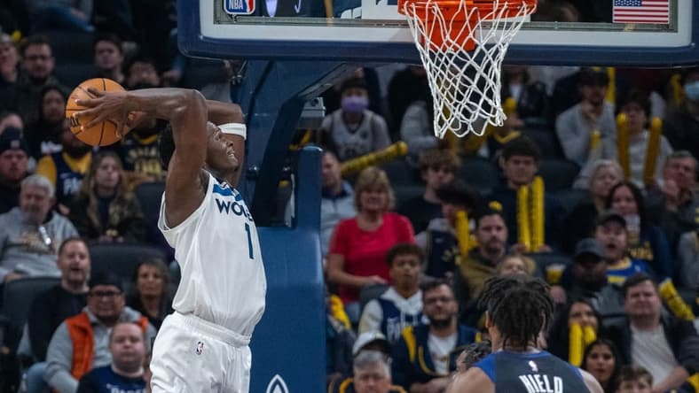 Nov 23, 2022; Indianapolis, Indiana, USA; Minnesota Timberwolves guard Anthony Edwards (1) slam dunks the ball in the second half against the Indiana Pacers at Gainbridge Fieldhouse. Mandatory Credit: Trevor Ruszkowski-USA TODAY Sports