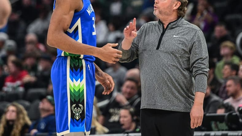 Nov 23, 2022; Milwaukee, Wisconsin, USA; Milwaukee Bucks forward Giannis Antetokounmpo (34) talks to head coach Mike Budenholzer in the first quarter during game against the Chicago Bulls at Fiserv Forum. Mandatory Credit: Benny Sieu-USA TODAY Sports