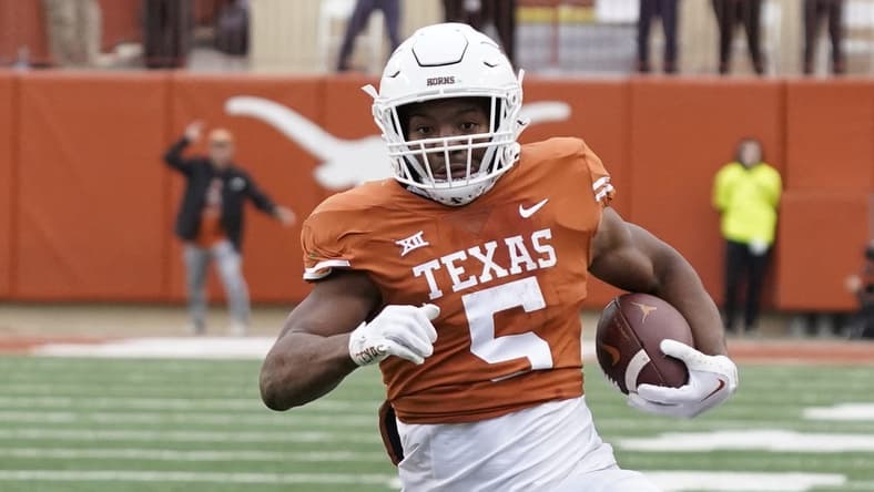 Nov 25, 2022; Austin, Texas, USA; Texas Longhorns running back Bijan Robinson (5) runs during the second half against the Baylor Bears at Darrell K Royal-Texas Memorial Stadium. Mandatory Credit: Scott Wachter-USA TODAY Sports