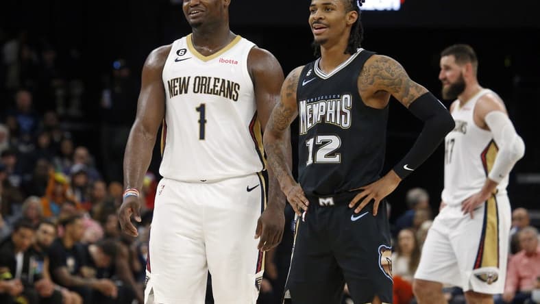 Nov 25, 2022; Memphis, Tennessee, USA; New Orleans Pelicans forward Zion Williamson (1) and Memphis Grizzlies guard Ja Morant (12) talk during free throws during the second half at FedExForum. Mandatory Credit: Petre Thomas-USA TODAY Sports