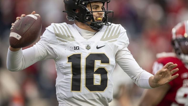 Nov 26, 2022; Bloomington, Indiana, USA; Purdue Boilermakers quarterback Aidan O'Connell (16) looks to throw a quick pass during the second quarter against the Indiana Hoosiers at Memorial Stadium. Mandatory Credit: Marc Lebryk-USA TODAY Sports