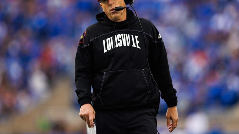 Nov 26, 2022; Lexington, Kentucky, USA; Louisville Cardinals head coach Scott Satterfield walks up the sideline during the first quarter against the Kentucky Wildcats at Kroger Field. Mandatory Credit: Jordan Prather-USA TODAY Sports
