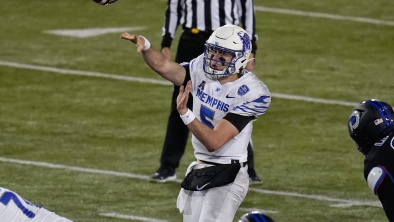 Nov 26, 2022; Dallas, Texas, USA;  Memphis Tigers quarterback Seth Henigan (5) passes the ball against the Southern Methodist Mustangs during the second half at Gerald J. Ford Stadium. Mandatory Credit: Chris Jones-USA TODAY Sports