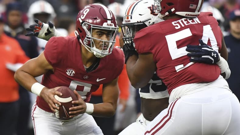 Nov 26, 2022; Tuscaloosa, Alabama, USA; Alabama Crimson Tide quarterback Bryce Young (9) drops back to pass as offensive lineman Tyler Steen (54) blocls against the Auburn Tigers at Bryant-Denny Stadium. Alabama won 49-27. Mandatory Credit: Gary Cosby Jr.-USA TODAY Sports
