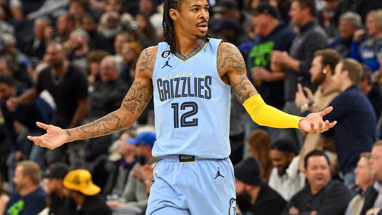 Nov 30, 2022; Minneapolis, Minnesota, USA; Memphis Grizzlies guard Ja Morant (12) questions a delay of game call made on him against the Minnesota Timberwolves during the second quarter at Target Center. Mandatory Credit: Nick Wosika-USA TODAY Sports