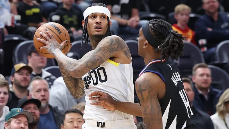 Nov 30, 2022; Salt Lake City, Utah, USA; Utah Jazz guard Jordan Clarkson (00) looks to pass the ball against Los Angeles Clippers guard Terance Mann (14) in the first quarter at Vivint Arena. Mandatory Credit: Rob Gray-USA TODAY Sports