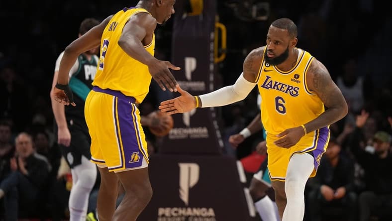 Nov 30, 2022; Los Angeles, California, USA; Los Angeles Lakers forward LeBron James (6) and center Thomas Bryant (31) celebrate against the Portland Trail Blazers in the first half at Crypto.com Arena. Mandatory Credit: Kirby Lee-USA TODAY Sports