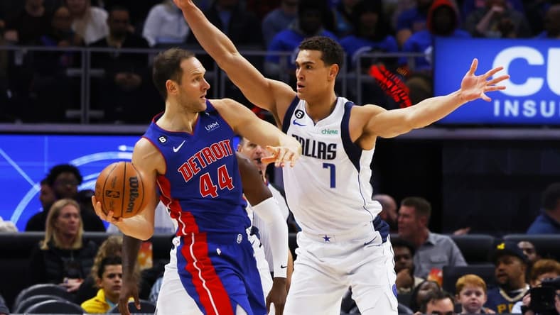 Dec 1, 2022; Detroit, Michigan, USA; Detroit Pistons forward Bojan Bogdanovic (44) is defended by Dallas Mavericks center Dwight Powell (7) in the first half at Little Caesars Arena. Mandatory Credit: Rick Osentoski-USA TODAY Sports