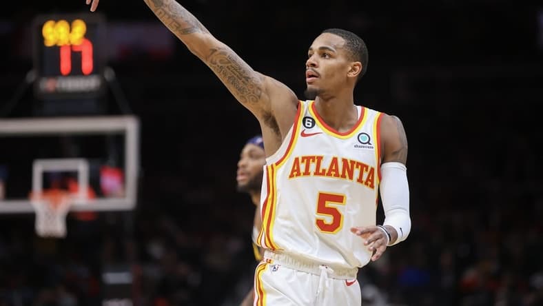 Dec 2, 2022; Atlanta, Georgia, USA; Atlanta Hawks guard Dejounte Murray (5) reacts after a three-point basket against the Denver Nuggets in the second quarter at State Farm Arena. Mandatory Credit: Brett Davis-USA TODAY Sports