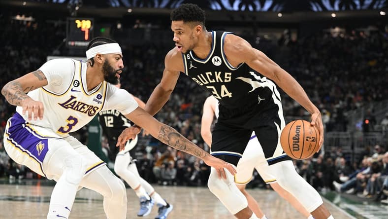 Dec 2, 2022; Milwaukee, Wisconsin, USA; Milwaukee Bucks forward Giannis Antetokounmpo (34) drives against Los Angeles Lakers forward Anthony Davis (3) in the first half at Fiserv Forum. Mandatory Credit: Michael McLoone-USA TODAY Sports