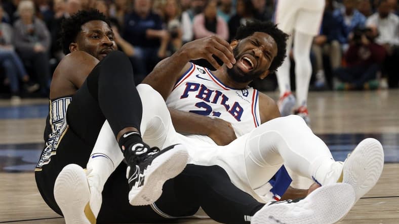 Dec 2, 2022; Memphis, Tennessee, USA; Memphis Grizzlies forward Jaren Jackson Jr. (13) and Philadelphia 76ers center Joel Embiid (21) get tangled up as they battle for a rebound during the first half at FedExForum. Mandatory Credit: Petre Thomas-USA TODAY Sports