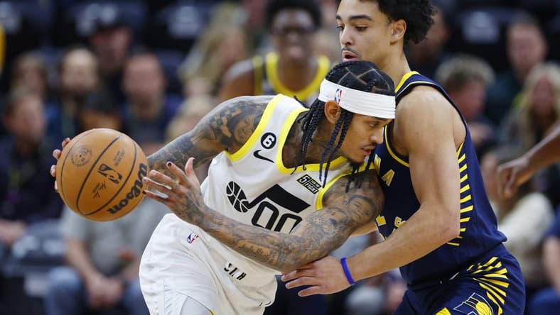 Dec 2, 2022; Salt Lake City, Utah, USA; Utah Jazz guard Jordan Clarkson (00) looks to drive on Indiana Pacers guard Andrew Nembhard (2) in the first quarter at Vivint Arena. Mandatory Credit: Jeffrey Swinger-USA TODAY Sports