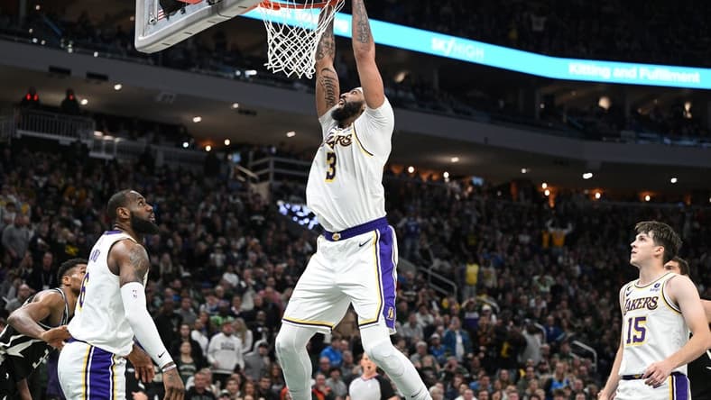 Dec 2, 2022; Milwaukee, Wisconsin, USA; Los Angeles Lakers forward Anthony Davis (3) dunks the ball in the closing minutes in the second half against the Milwaukee Bucksat Fiserv Forum. Mandatory Credit: Michael McLoone-USA TODAY Sports