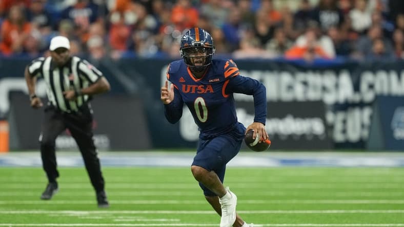 Dec 2, 2022; San Antonio, Texas, USA;  UTSA Roadrunners quarterback Frank Harris (0) runs the ball in the second half against the North Texas Mean Green at the Alamodome. Mandatory Credit: Daniel Dunn-USA TODAY Sports