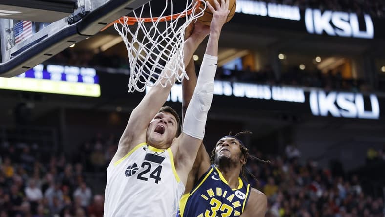 Dec 2, 2022; Salt Lake City, Utah, USA;  Utah Jazz center Walker Kessler (24) and Indiana Pacers center Myles Turner (33) battle in the second half at Vivint Arena. Mandatory Credit: Jeffrey Swinger-USA TODAY Sports