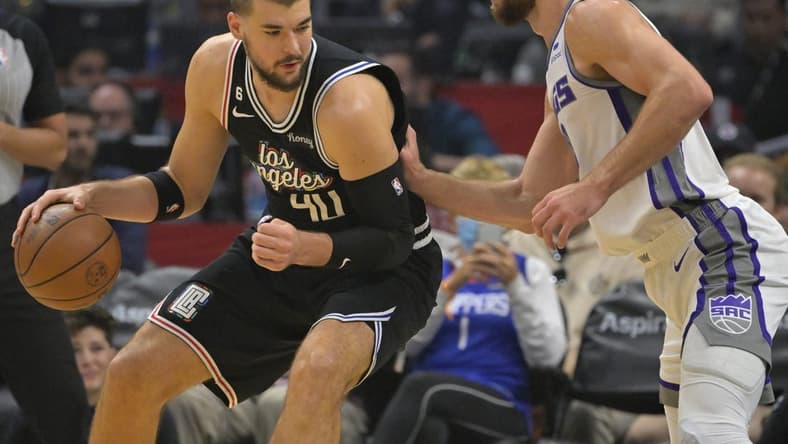 Dec 3, 2022; Los Angeles, California, USA; Los Angeles Clippers center Ivica Zubac (40) is defended by Sacramento Kings forward Domantas Sabonis (10) in the first half at Crypto.com Arena. Mandatory Credit: Jayne Kamin-Oncea-USA TODAY Sports