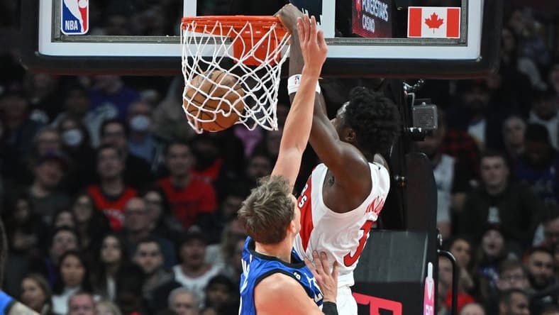 Dec 3, 2022; Toronto, Ontario, CAN; Toronto Raptors forward OG Anunoby (3) dunks for a basket over Orlando Magic forward Franz Wagner (22) in the first half at Scotiabank Arena. Mandatory Credit: Dan Hamilton-USA TODAY Sports
