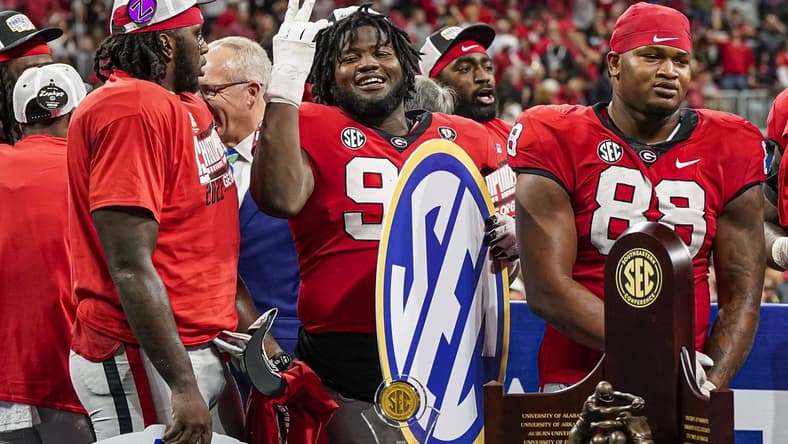 Dec 3, 2022; Atlanta, GA, USA; Georgia Bulldogs players react after defeating the LSU Tigers in the SEC Championship game at Mercedes-Benz Stadium. Mandatory Credit: Dale Zanine-USA TODAY Sports
