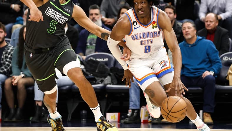 Dec 3, 2022; Minneapolis, Minnesota, USA; Oklahoma City Thunder forward Jalen Williams (8) dribbles the ball against Minnesota Timberwolves forward Kyle Anderson (5) during the second quarter at Target Center. Mandatory Credit: Matt Krohn-USA TODAY Sports