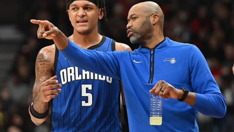 Dec 3, 2022; Toronto, Ontario, CAN; Orlando Magic head coach Jamahl Mosley speaks to forward Paolo Banchero (5) in the first half against the Toronto Raptors at Scotiabank Arena. Mandatory Credit: Dan Hamilton-USA TODAY Sports