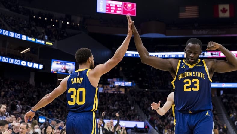 Dec 3, 2022; San Francisco, California, USA; Golden State Warriors guard Stephen Curry (30) and forward Draymond Green (23) celebrate during the second half against the Houston Rockets at Chase Center. Mandatory Credit: John Hefti-USA TODAY Sports